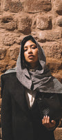 Woman wearing an elegant baby alpaca shawl and coat 